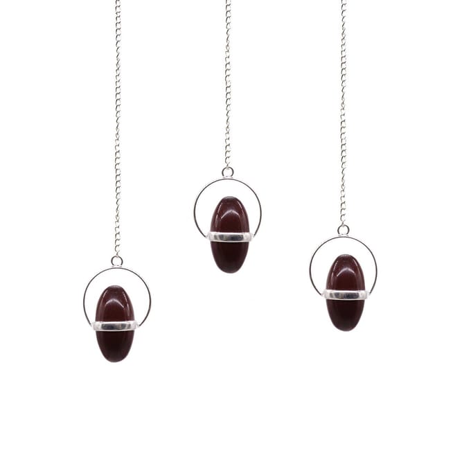 Shiva Lingam met bandpendel