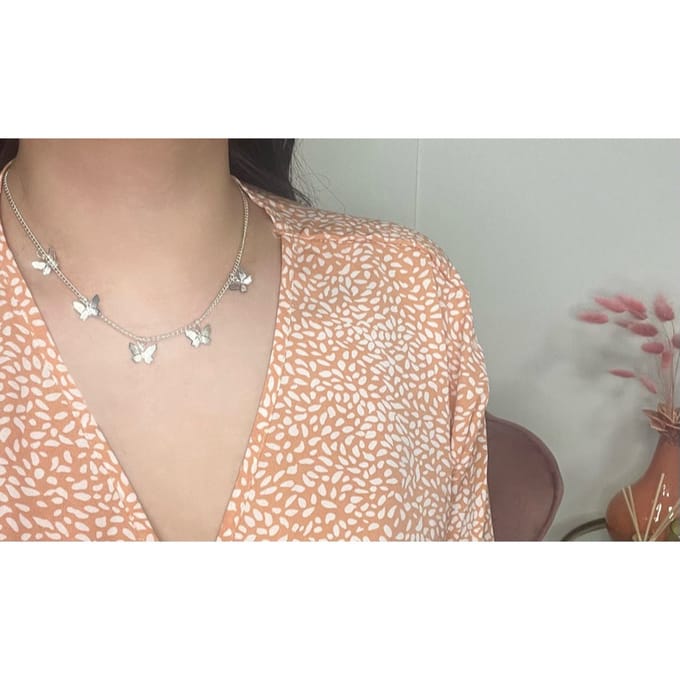 Vlinders ketting | zilver gekleurd
