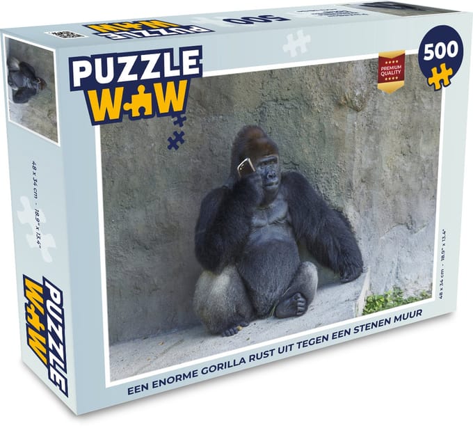 Puzzel Een enorme Gorilla rust uit tegen een stenen muur - Legpuzzel - Puzzel 500 stukjes