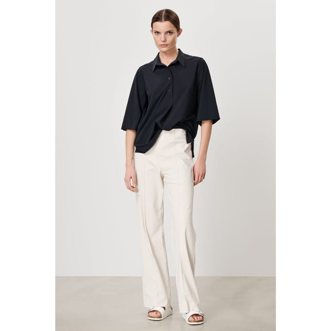 TRVL DRSS Arles Polo Top Black Maat: XS | Pantalons Outlet | Dames | Wit