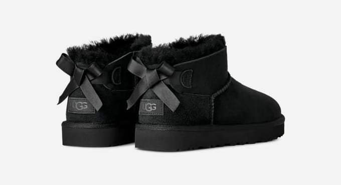 UGG® Ultra Mini Bailey Bow Boot in Black, Size 9, Polyester/Leather
