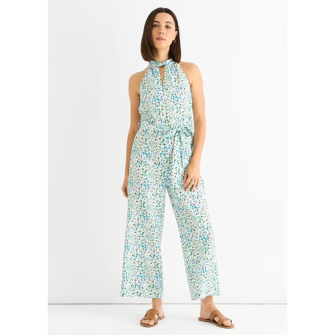 Blauwe jumpsuit met bloemenprint en halternek