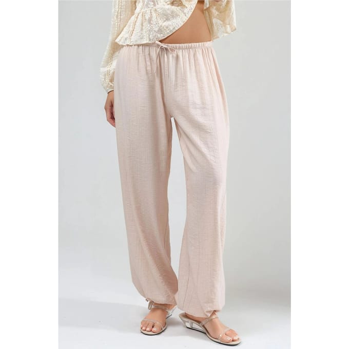 Elastische broek met strikdetail