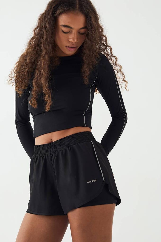 Dames DSGN Studio Reflecterende Binding 2-in-1 Hardloopshorts | Zwart | Maat: XS