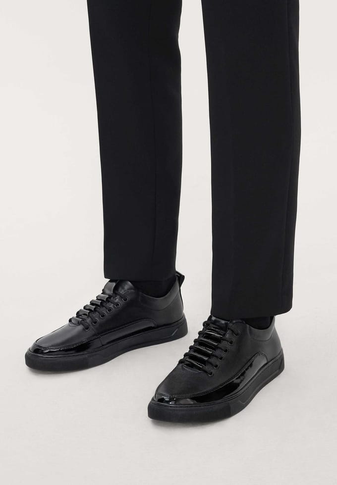 Heren sneakers van zwart leer met elegante inzetstukken
