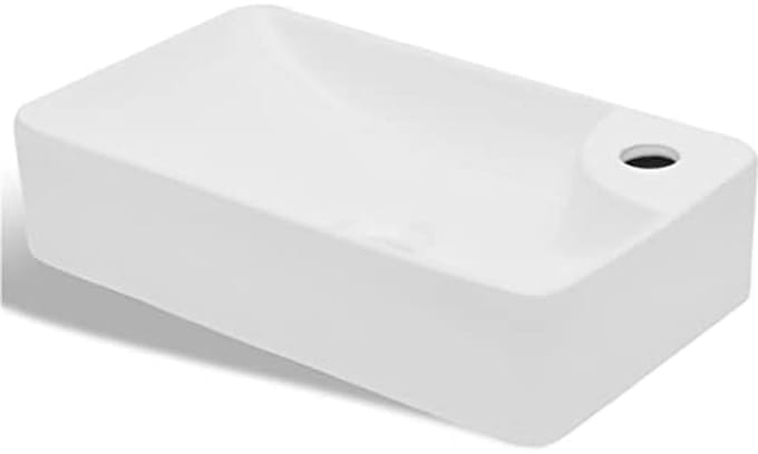 Witte keramische wastafel met kraangat