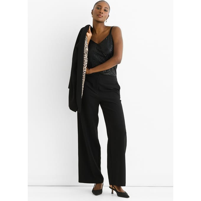 Zwarte cape-blazer met contrasterende dierenprint voering